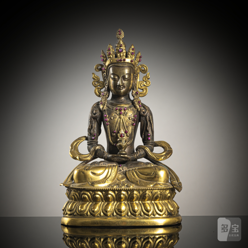 A part-gilt copper repoussé figure of Amitayus with glass and stone inlays